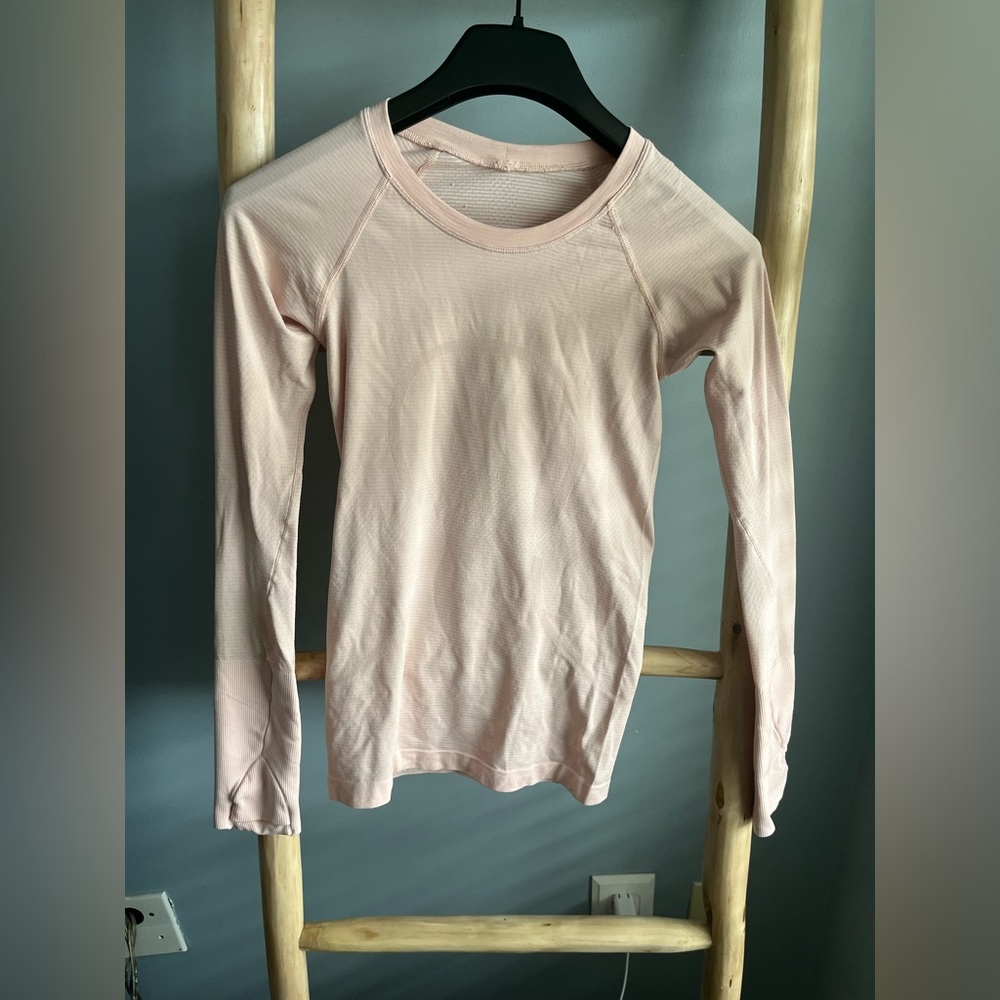 Lululemon swiftly tech long sleeve. Very faint light pink.